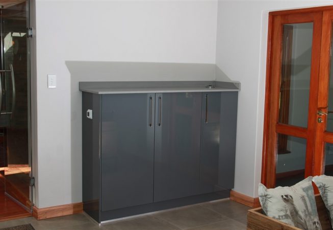 Cupboard in Gloss Storm Grey melamine with Grey quartz top