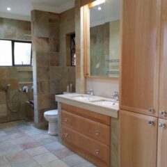 Bathroom Storage cupboard in Solid Pink Beech drawer fronts and Bavarian Beech melamine drawer insides