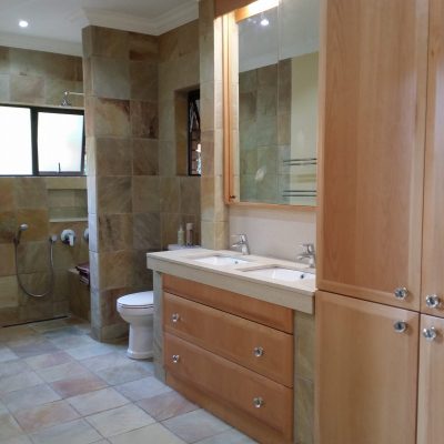 Bathroom Storage cupboard in Solid Pink Beech drawer fronts and Bavarian Beech melamine drawer insides