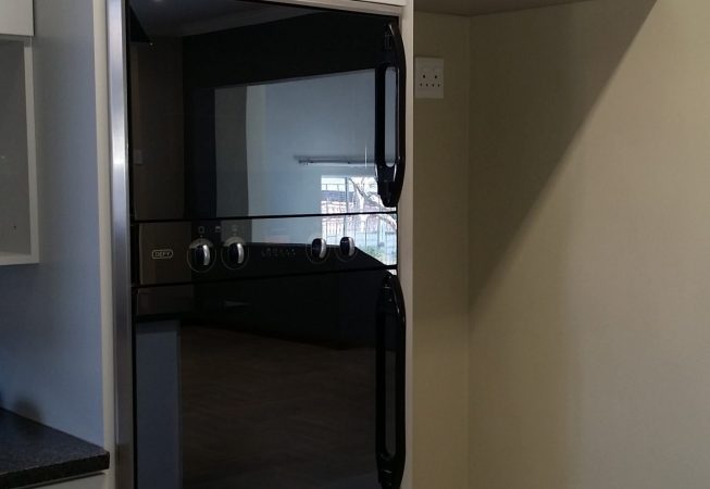 Kitchen renovation done with Folkstone Grey and Rustenburg granite tops