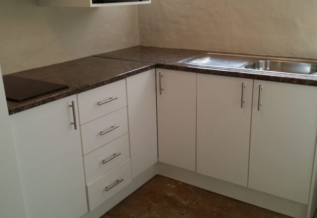 Guest Flat Kitchen in white melamine with Mocha Granite formica top