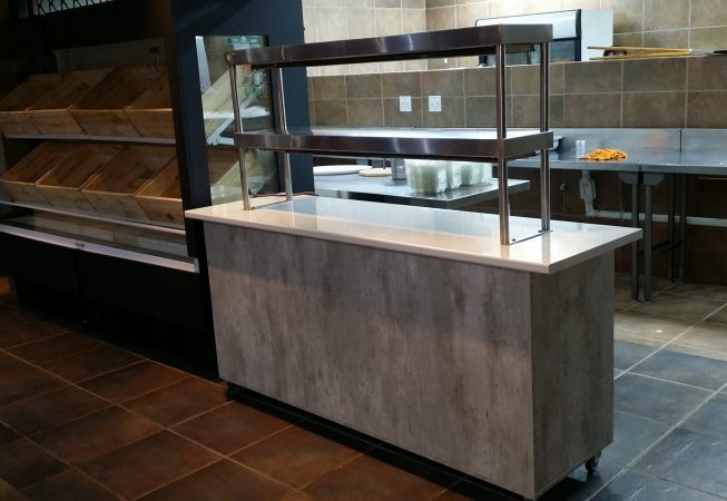 Shopfitting in Natural Concrete melamine with Kristal Gloss formica top