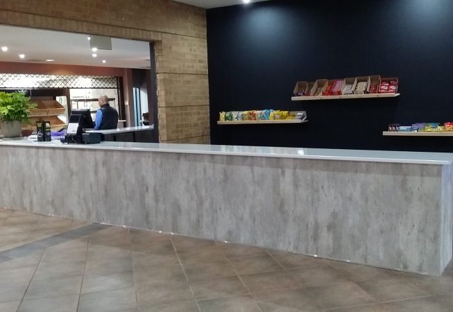 Shopfitting in Natural Concrete melamine with Kristal Gloss formica top