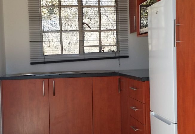 Kitchen in Cherry Royale melamine with Rustenburg granite