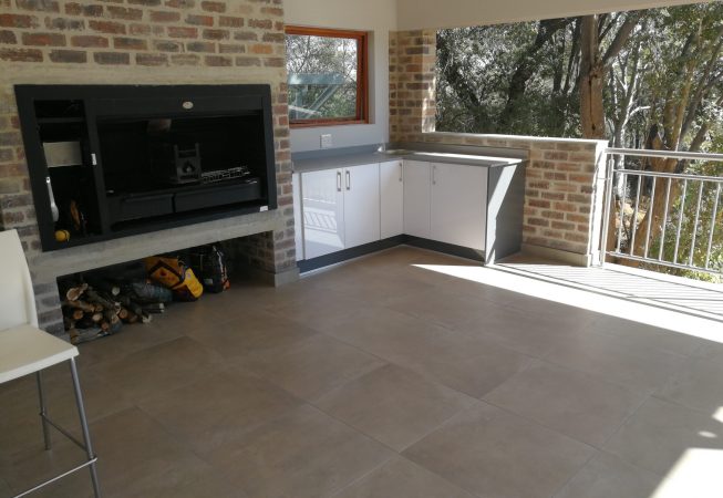 Patio storage cupboards in Gloss Iceberg White with Grey Quartz tops
