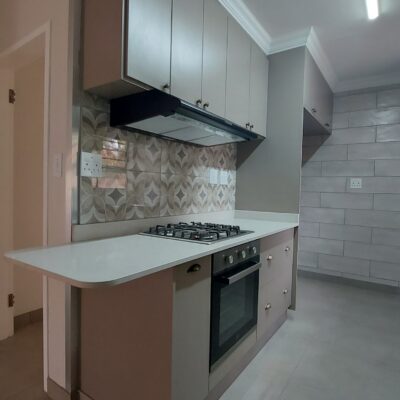 Kitchen revamp in Congo melamine and Vanilla quartz tops