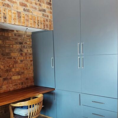 Bedroom cupboards installation using Storm Grey melamine.