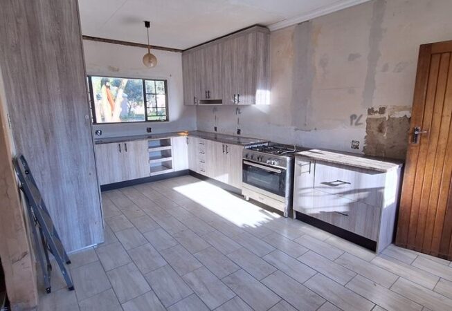 Kitchen revamp using Lanza Oak melamine with Mocha Granite formica tops