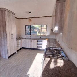 Kitchen revamp using Lanza Oak melamine with Mocha Granite formica tops