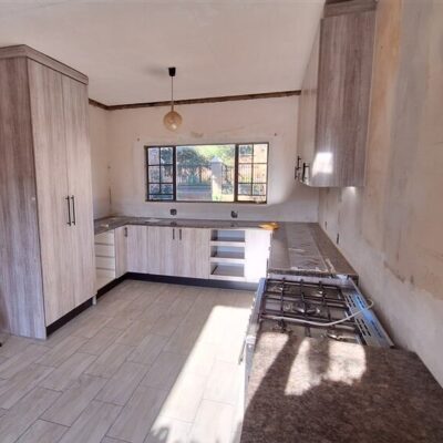 Kitchen revamp using Lanza Oak melamine with Mocha Granite formica tops