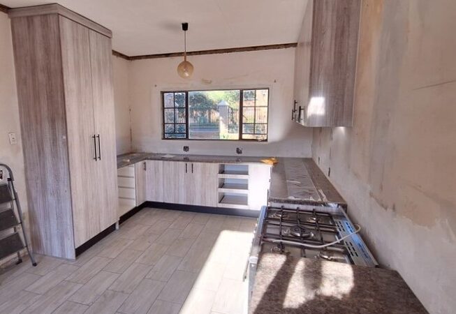 Kitchen revamp using Lanza Oak melamine with Mocha Granite formica tops