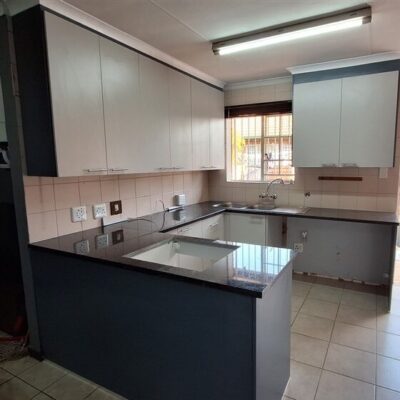 Kitchen revamp using Folkstone Grey with Storm Grey side panels and Rustenburg granite.