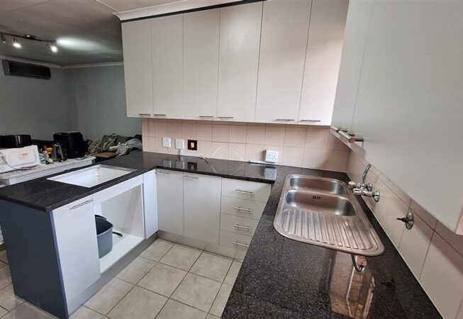 Kitchen revamp using Folkstone Grey with Storm Grey side panels and Rustenburg granite.