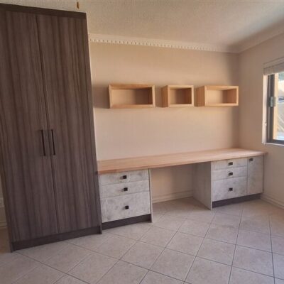 Anchor Point melamine cupboard with Elmina drawer units. Solid Saligna top and wall boxes