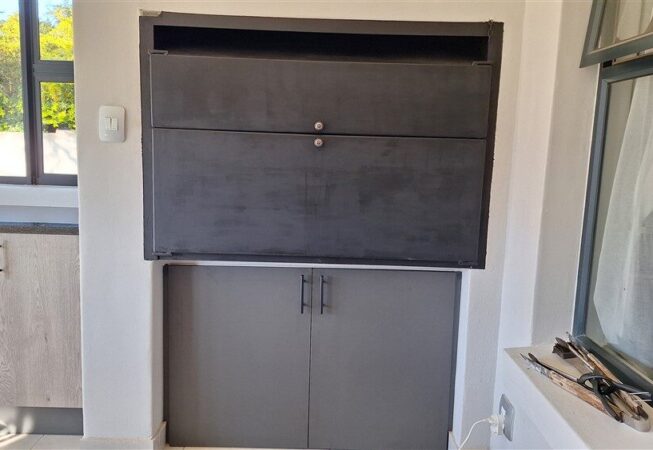 Under-Braai cupboards doors installation in Strom Grey Melamine