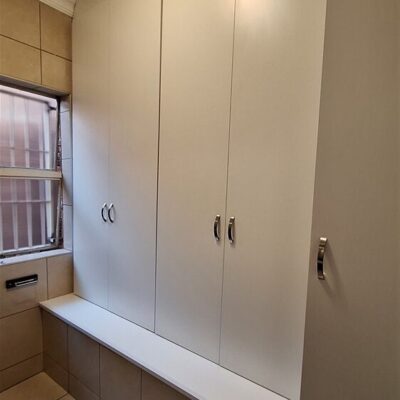 Second Bathroom converted into a storage room using White Melamine