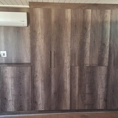 Wall unit in Monument Oak and white melamine interior.