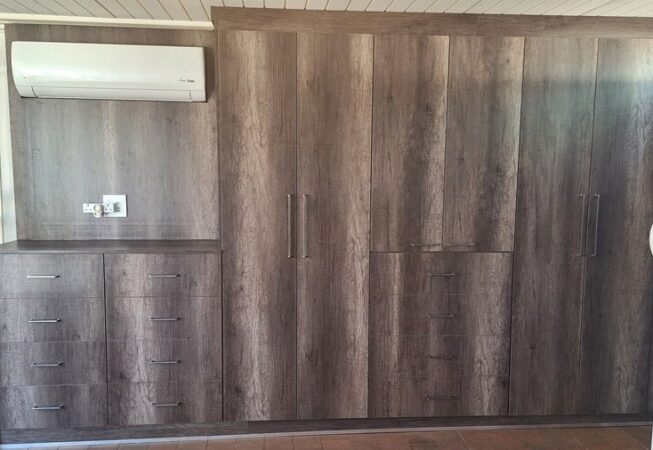 Wall unit in Monument Oak and white melamine interior.