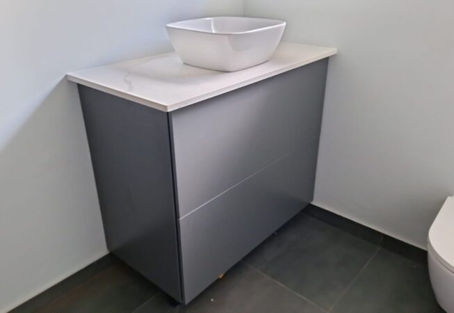 Bathroom revamp using Folkstone Grey melamine with Vanilla quartz top