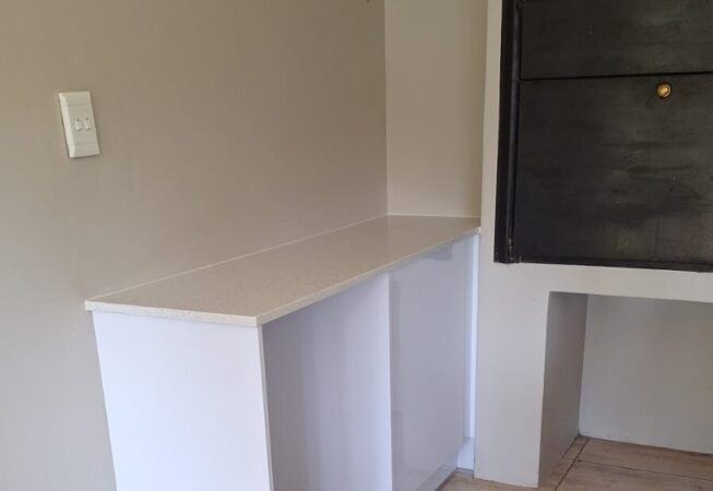 Braai area upgrade using Gloss White melamine with Vanilla quartz top
