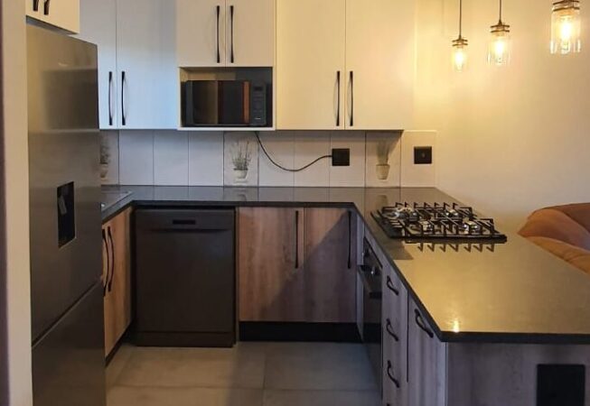 Kitchen revamp using White and Camden melamine with Rustenburg granite tops