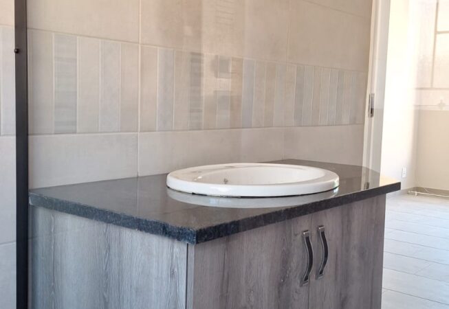 Bathroom revamp using Camden melamine with Rustenburg granite top