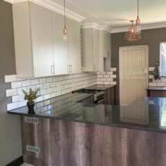 Kitchen revamp using Monument Oak and Folkstone Grey melamine and Rustenburg Granite Tops