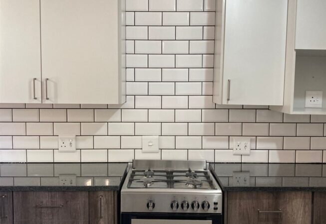 Kitchen revamp using Monument Oak and Folkstone Grey melamine and Rustenburg Granite Tops