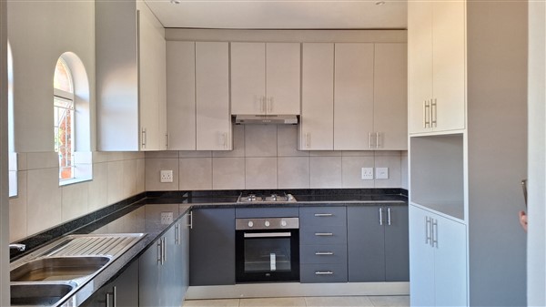 Kitchen Renovation using Folkstone grey and Storm grey Melamine and Rustenburg Granite